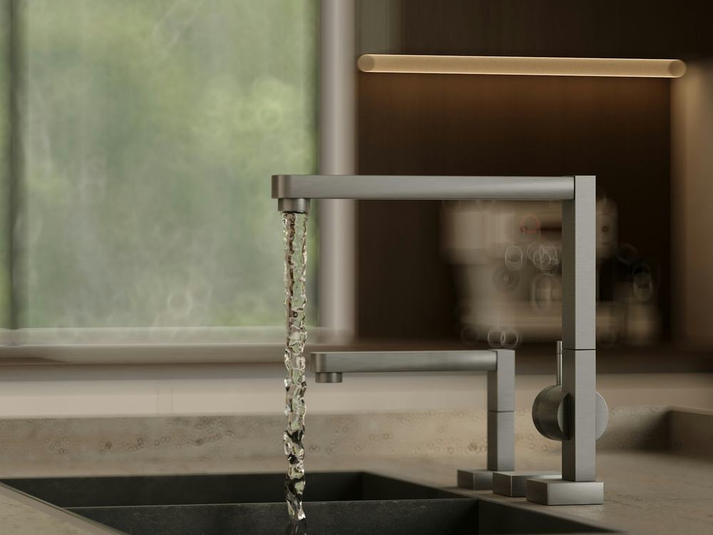 Water flowing from a modern kitchen faucet